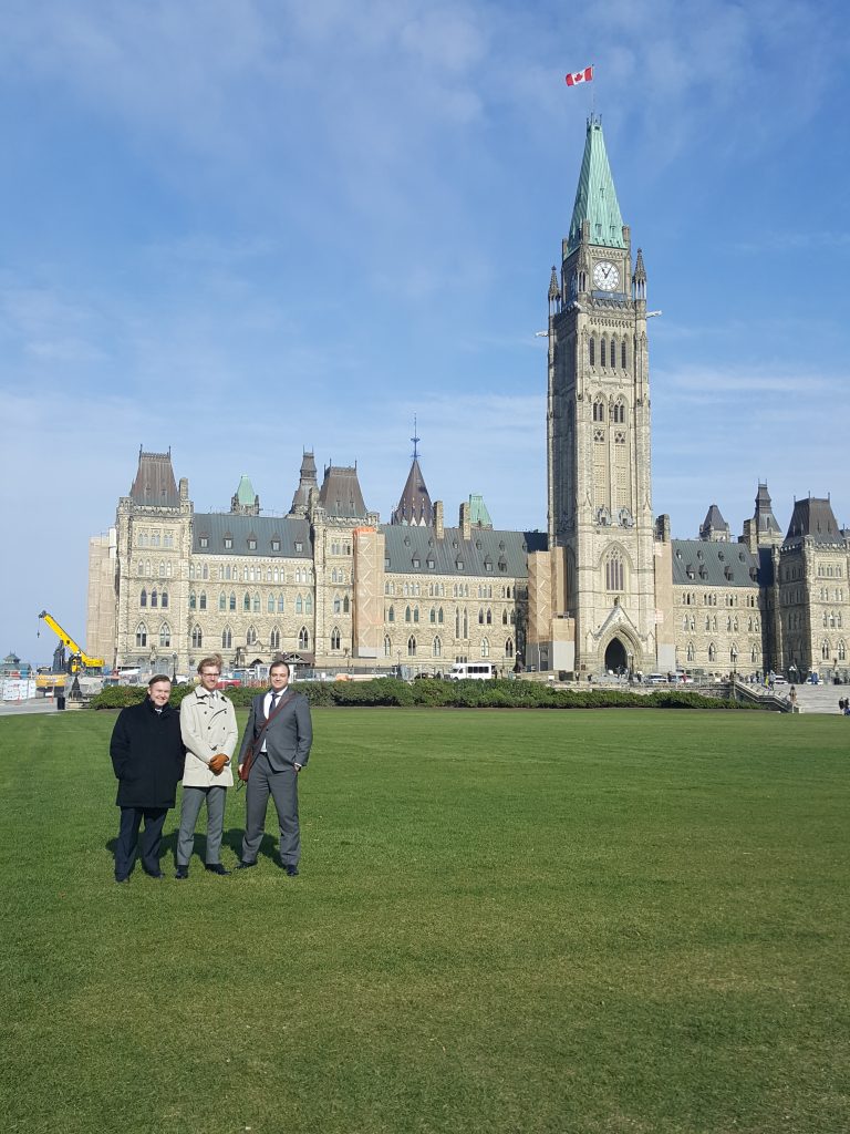 A photo - ARCH Executive Director Robert Lattanzio with Disability Law Intensive students
Cameron MacInnis and Christopher McGoey in front of the building in the Parliament Hill