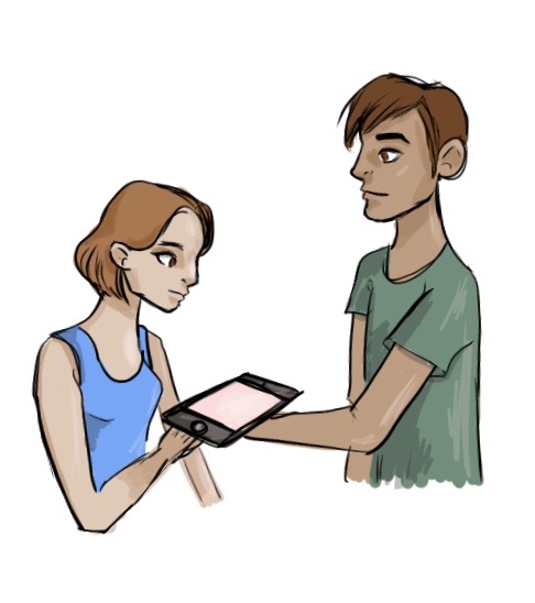 woman handing an electronic device to a man
